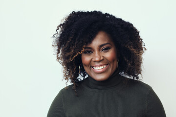 Wall Mural - Portrait Of Happy Young African American Woman With Curly Hair