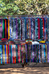 Wall Mural - Handmade colorful Burmese fabric for sell in a tourist stall on the street market near Inle Lake in Burma, Myanmar