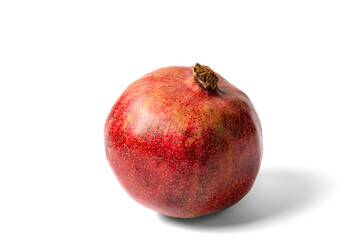 Wall Mural - Close up of pomegranate fruit isolated on white background with shadow.