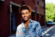 © ADDICTIVE STOCK - Trendy young black man portrait posing in the street