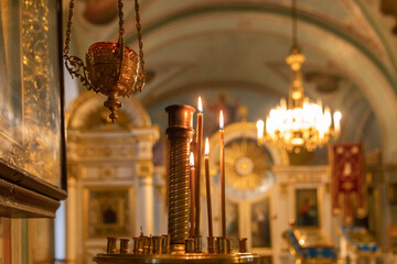 Wall Mural - Orthodox Church. Christianity. Festive interior decoration with burning candles and icon in traditional Orthodox Church on Easter Eve or Christmas. Religion faith pray symbol