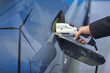 © chartphoto - Double exposure of EV charging station for electric car in concept of green sustainable energy produced from renewable resources to supply to charger station in order to reduce CO2 emission .
