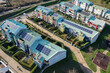 Modern houses with solar panels on the roof for alternative energy. Grugliasco, Italy - November 2021