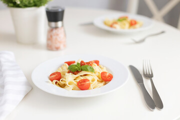 Wall Mural - Fresh Italian pasta with cherry tomatoes, cheese and basil. Vegetarian spaghetti. Healthy food.