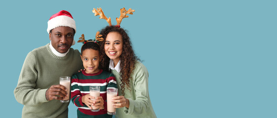 Poster - African-American family with Christmas decor and tasty hot chocolate on color background with space for text