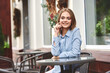 © VICHIZH - Business woman in a cafe in the summer outdoors on vacation