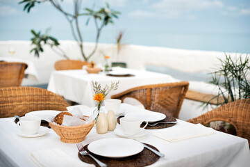 Set tables at an outdoor restaurant