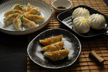 Wall Mural - Popular Japanese food, steamed Japanese gyoza dumplings with meat buns.