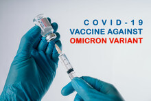 Omicron Variant Of SARS-CoV-2. New B.1.1.529 Variant Of Concern. Doctor Holds Vaccine Against New Covid-19 Omicron Variant. New Generation Vaccine Against..