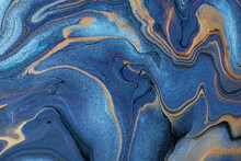 Abstract Fluid Art Background Navy Blue And Brown Colors. Liquid Marble. Acrylic Painting With Golden Gradient.
