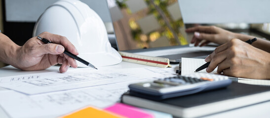 Wall Mural - construction concept of engineer or architect meeting for project working with partner and engineeri