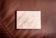 © hitdelight - Luxury marble and brown paper color background with tropical palm shadow. Natural material with exotic plant shade branding layout. Minimal flat lay product podium with leaf silhouette overlay.