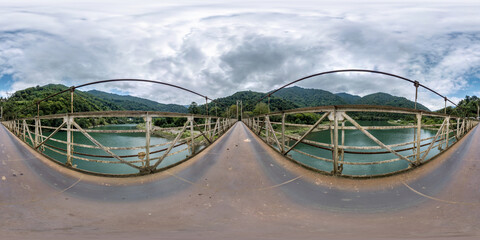 Wall Mural - full seamless 360 hdri panorama on on metal bridge over fast river in mountains with in equirectangular spherical projection. VR  AR content