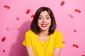 Wall Mural - Portrait of attractive cheerful brown-haired girl enjoying good mood 14 February isolated over pink pastel color background