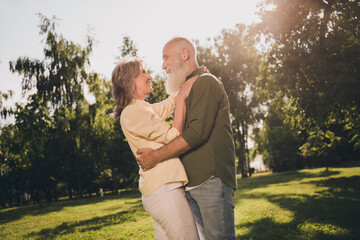 Canvas Print - Photo of two cheerful inspired dream old people embrace enjoy sunny day wear casual outfit nature park garden outside