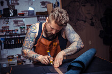 Man Working With Leather Produces Leather Goods