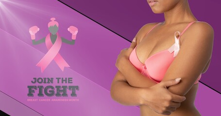 Wall Mural - Midsection of woman in bra by breast cancer awareness slogan on purple background