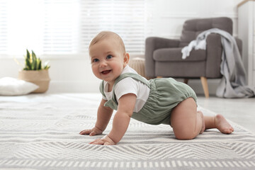 cute baby crawling on floor at home