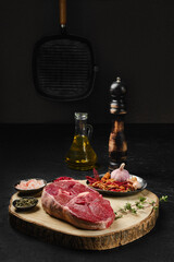 Wall Mural - Raw lamb center cut leg steak with spice on the kitchen table