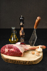 Wall Mural - Raw lamb short cut leg, sirloin off on wooden cut log