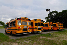 Row Of Yellow School Buses On Parking Lot. Onset, Massachussets, 23.07.2019.