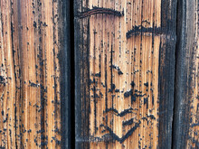 Old Weathered Wood With Patina And Carved Heart. Wood Plank Wall, Pattern For Design And Decoration. Close Up.