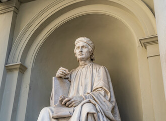 Wall Mural - The statue of Italian and Florentine architect Arnolfo di Cambio, located in a niche in front of the  right side of Florence Cathedral, Florence city center, Tuscany region, Italy