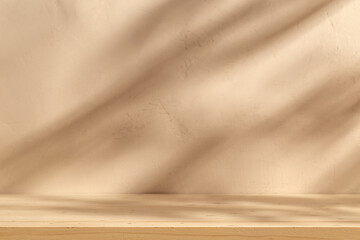 wooden table mockup on beige stucco background with branch shadows on the wall. mock up for branding