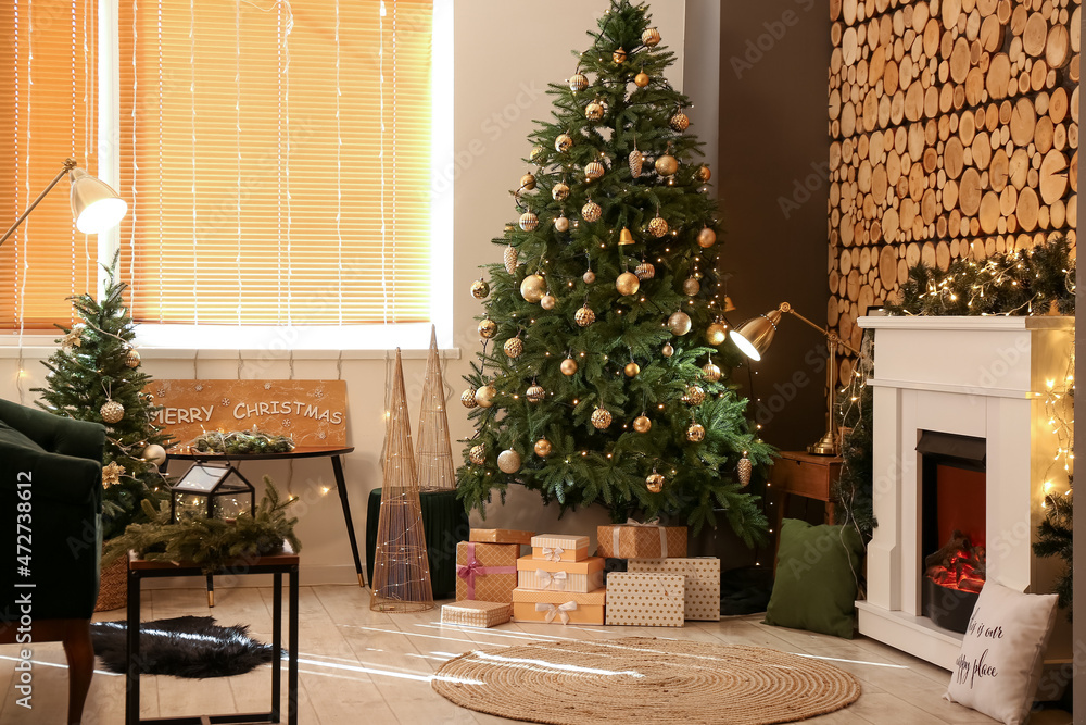 Stylish interior with Christmas tree and decorated fireplace