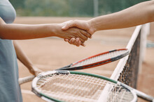 Professional Tennis Players Shaking Hands At The Net