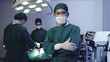© sorapop - Surgeon doctor posing with arms crossed, Medical surgical doctor team performing surgery patient on operating room with electrocautery equipment for cardiovascular emergency surgery center in hospital