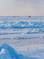 Wall Mural - Ships in the sea ice of the frozen Disko Bay during winter, West Greenland, Denmark