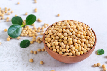 Wall Mural - soybean or soya bean in wooden bowl on white table background.