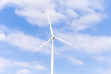 Wall Mural - Wind turbines of global ecology with cloud background on the sky. alternative electricity source to be sustainable resources in the future. Clean energy concept saves the world