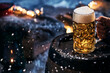 © exclusive-design - Person wit glass of beer in winter garden