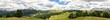 Hyper panorama of the Italian Dolomites. View of peaks and meadows with forests