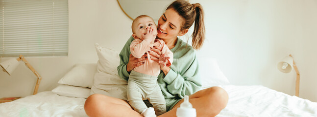 loving mother smiling at her baby