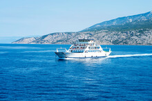 Car Ferry Boat In Croatia Linking The Island Rab To Mainland Passing By On Adriatic Sea.