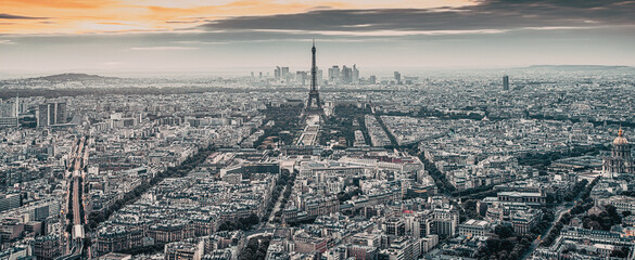 aerial view over Paris at sunset with iconic Eiffel tower