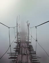 Suspension Bridge In The Fog