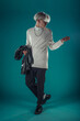 © qunica.com - Male beauty concept. Portrait of fashionable young man with stylish haircut wearing trendy glasses and sweater, posing over gray background. Perfect hair & skin. Hipster style. Copy-space. Studio shot