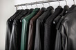 © mehmet - New collection of different color spring leather jackets. Leather jackets on hangers in the shop. Colorful background of modern spring, autumn outerwear. Seasonal clothing in store on sale.