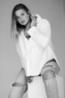 © kalinichenkod - attractive chubby girl posing in white shirt. body positive concept