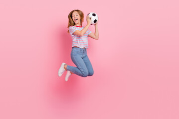 Sticker - Full body photo of cute teen blond girl jump with ball wear t-shirt jeans shoes isolated on pink background