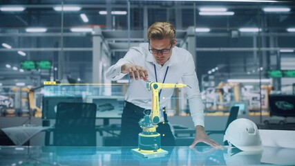 Leinwandbilder - Industry 4.0 High-Tech Factory: Robotics Engineer Working on Robot Arm Design, Using Augmented Reality Hologram to Manipulate 3D Model by Gestures. Futuristic Engineering with Digital Technology