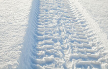 Wheel Tracks On The Snow.