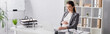 © LIGHTFIELD STUDIOS - happy pregnant businesswoman looking at laptop in office, banner.