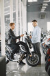 © prostooleh - Handsome man choosing a motorcycle to buy