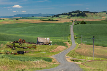 Sticker - Elevated view of rural road and abandoned schoolhouse, Palouse region of eastern Washington.