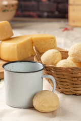 Cheese bread, breakfast table in Brazil, cheese bread, coffee and accessories, selective focus.